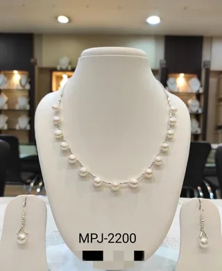 White — Pearl bead necklace with matching earrings