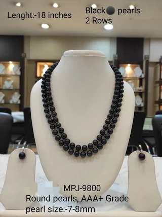 Double-strand black pearl necklace with matching stud earrings
